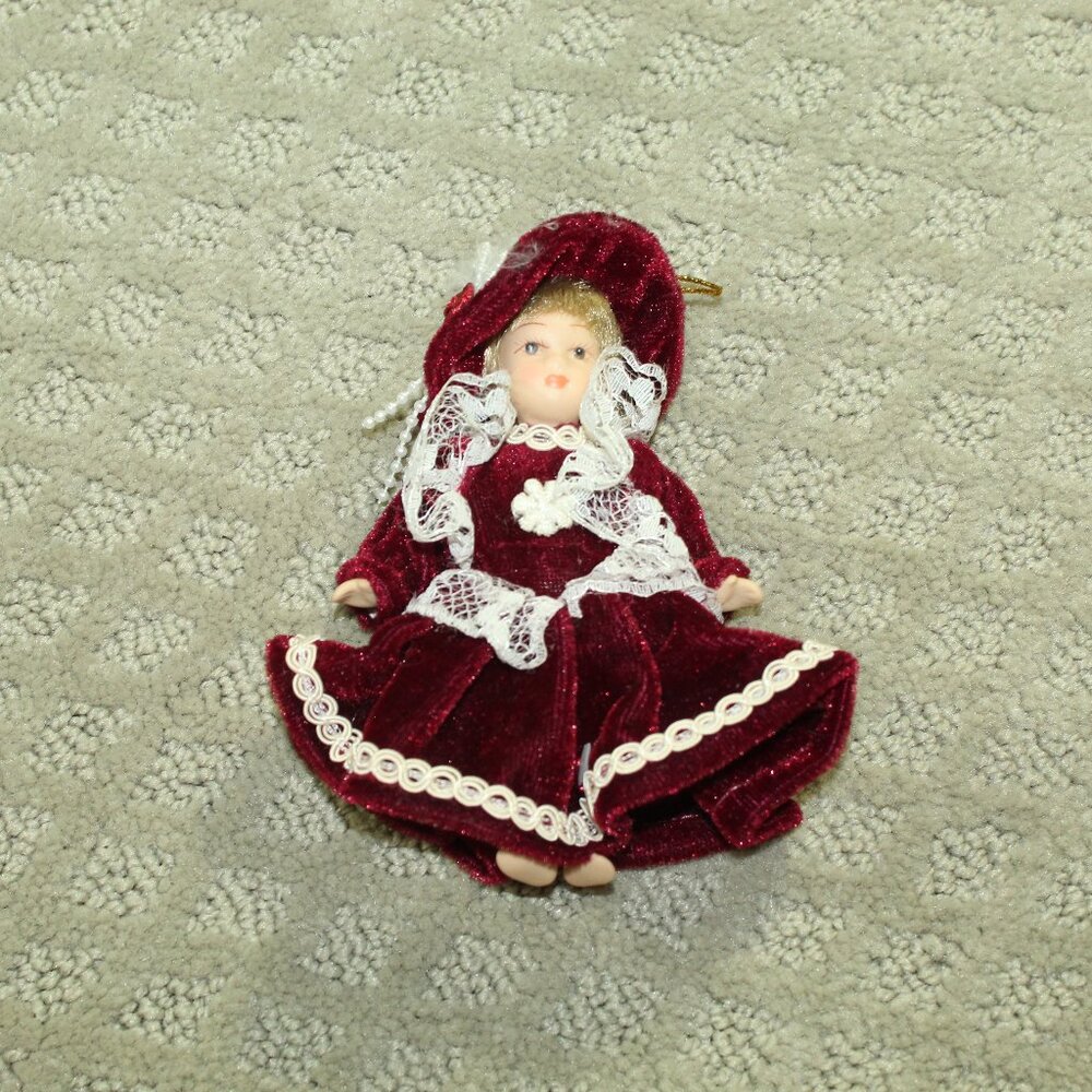 Vintage Victorian-style Ceramic Christmas Ornament Doll in Maroon Dress